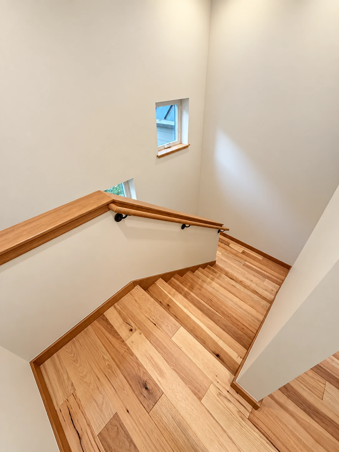 Ross Rd finished hardwood stairwell